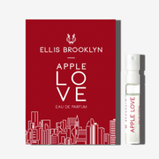 Apple Love 1.5ml Eau De Parfum Vial next to red Apple Love Eau De Parfum vial holder card.