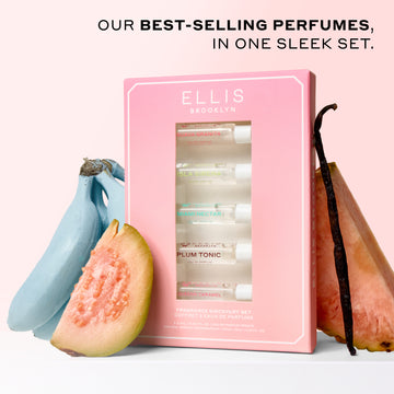 Best Sellers Discovery Set between blue bananas, slice of guava, vanilla bean, and slice of pink pineapple on a white surface with a pink background with black text that reads 