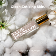 Blond Musk Fragrance Oil 15ml resting on cotton and white flowers between white text that reads 
