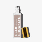 Huile parfumée Blond Musk (15 ml), bouchon retiré, sur fond blanc.