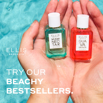 Hands holding Miami Nectar 7.5ml Eau De Parfum Mini Dabber and Guava Granita 7.5ml Eau De Parfum Mini Dabber on the surface of pool water, white Ellis Brooklyn logo, and white text that reads 