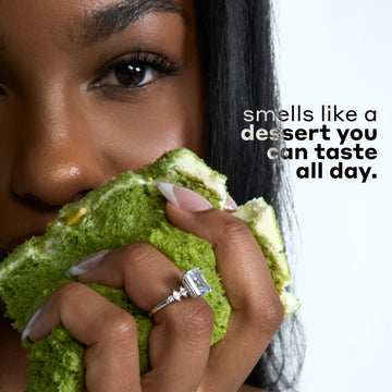 Woman with black hair wearing a diamond ring and holding green cake with white icing against a white background with black and gray text that reads 