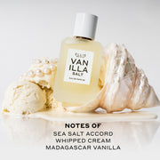 Vanilla Salt 50ml Eau De Parfum resting on white shell in melted vanilla ice cream next to scoops of vanilla ice cream and pearls on white background above black text that reads 