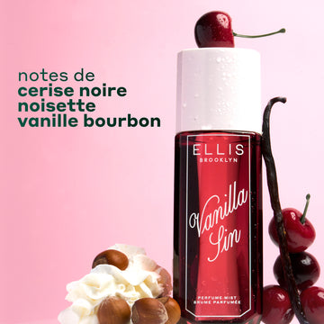Brume Parfumée VANILLA SIN 240ml surmontée d'une cerise et entourée de 4 cerises empilées, une gousse de vanille appuyée contre le flacon et un tas de crème fouettée avec 4 noisettes sur un fond dégradé rose et blanc avec un texte noir indiquant 