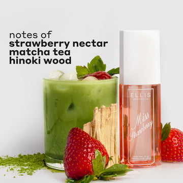 MISS STRAWBERRY Perfume Mist 90ml next to matcha powder, two strawberries, hinoki wood, and a glass cup filled with ice, matcha tea, and a strawberry with black text that reads 