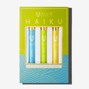 Green, blue, and gold Haiku Fragrance Rollerball Trio Box showing Salt 10ml Fragrance Rollerball, Sun Fruit 10ml Fragrance Rollerball, and Sweet 10ml Fragrance Rollerball, on white background.