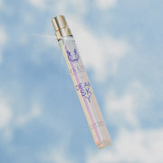 Chère Sky 10 ml Eau de Parfum Spray de Voyage sur fond de ciel et de nuages.