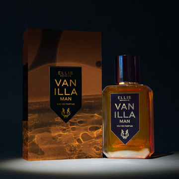 Vanilla Man 50 ml Eau de Parfum à côté de la boîte Vanilla Man Eau de Parfum sous le projecteur, sur fond noir.