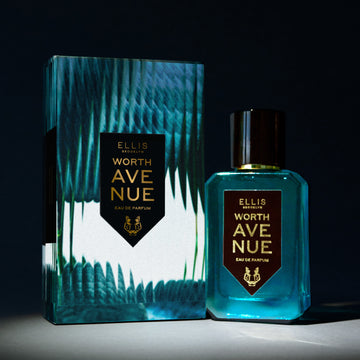 Worth Avenue 50ml Eau De Parfum next to Worth Avenue Eau De Parufm box in spotlight, on black background. | english_image