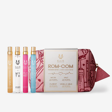 Vanilla Milk 10ml Eau De Parfum Travel Spray, Myth 10ml Eau De Parfum Travel Spray, Florist 10ml Eau De Parfum Travel Spray, and Salt 10ml Eau De Parfum Travel Spray in front of red and pink pattered Rom-Com Fragrance Gift Set bag. | english_image