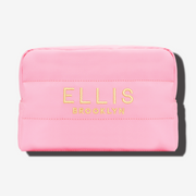 Pink Cosmetic Bag with gold embroidery that reads 