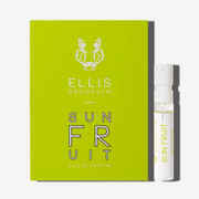 Sun Fruit 1.5ml Eau De Parfum Vial next to yellow green Sun Fruit Eau De Parfum vial holder card.
