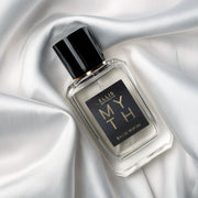 Myth 50ml Eau De Parfum on white satin sheet.