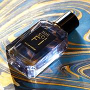 Sci Fi 50ml Eau De Parfum on blue and yellow marbled background.