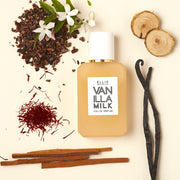 Vanilla Milk 50ml Eau De Parfum on off-white background with vanilla beans, sandalwood, white flowers, and cocoa shells.