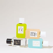 Sun Fruit 7.5ml Eau De Parfum Mini Dabber stacked on Myth 7.5ml Eau De Parfum Mini Dabber next to Vanilla Milk 7.5ml Eau De Parfum Mini Dabber, stacked on top of Salt 7.5ml Eau De Parfum Mini Dabber, on white background.